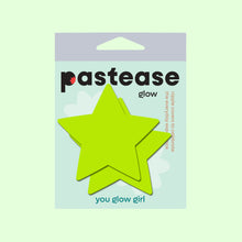 Load image into Gallery viewer, Packaging of Star Neon Yellow Pasties Glow in the Dark Star Nipple Covers by Pastease®, showing two bright yellow star-shaped pasties against a light background. The packaging includes the tagline "you glow girl." Perfect for all breast shapes and sizes, handmade in the USA.