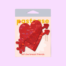 Load image into Gallery viewer, Cupid's Arrow Red Heart Breast Pasties by Pastease® in their original packaging. The design features a sparkling red heart pierced by an arrow, perfect for Valentine’s Day or romantic occasions. Fun, flirty, and designed to fit all breast shapes and sizes. Made in the USA.