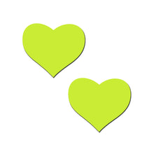 Load image into Gallery viewer, A pair of Pastease Glow in the Dark Neon Yellow Heart Nipple Covers. Bright and bold, these nipple pasties are perfect for festivals, rave nights, or intimate moments. Designed for all shapes and sizes, they’re proudly handmade in the USA by Pastease®.