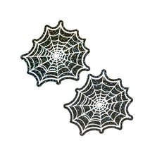 Load image into Gallery viewer, A pair of Web: Glitter Black Glow in the Dark Spooky Spider Web Nipple Covers by Pastease®. Glittery black and white spiderweb-shaped covers that glow in the dark. Perfect for themed parties or bold lingerie looks. Handmade in the USA and designed for diverse breast shapes.