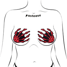 Load image into Gallery viewer, Blood Red Skeleton Hand Nipple Pasties modelled, highlighting their edgy, bold look. Designed for comfort and a secure fit. Perfect for playful nights, festivals, or creative outfits. Made in the USA by Pastease®, a family-run small business.