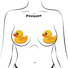 Load image into Gallery viewer,  Pastease® Rubber Duck Breast Pasties modelled on a figure, showing their playful yet secure fit. Perfect for expressing individuality at festivals, parties, or events. A vibrant choice from this USA-based family business.