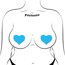 Load image into Gallery viewer, A closer view of the same stylised figure wearing Pastease® Glow in the Dark Neon Turquoise Heart Pasties. Perfectly shaped hearts glow brightly in the dark, crafted by a USA-based family business for playful, unique moments.