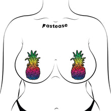 Load image into Gallery viewer, Rainbow Pineapple Sparkling Breast Pasties by Pastease® on a model with a sultry style, showcasing the bright, glittery pineapple design. Designed for comfort and bold fun, these waterproof nipple covers suit all breast shapes and sizes, perfect for any occasion.