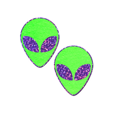 Load image into Gallery viewer, Alien: Glow-In-The-Dark with Glittering Purple Eyes Nipple Pasties by Pastease®. Two bright green extraterrestrial alien heads with glitter purple eyes nipple covers shown on a white background. Perfect for festivals, pride, burlesque, raves, only fans content or parties.