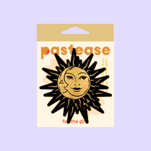 Load image into Gallery viewer, Sunburst: Sun & Moon Faces on Gold Glitter Sun Nipple Pasties by Pastease®. Two glittery gold and black nipple covers in the shape of a sun and moon, shown on a pastel purple background. Perfect for a festival, burlesque performance, pride or parties.