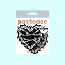 Load image into Gallery viewer, The Barbed Wire Heart Pasties Reflective Nipple Covers by Pastease®. Two black hearts with silver reflective barbed wire patterned shaped nipple covers shown in the pastease pastel packaging on a pastel blue background. Perfect for festivals, pride, burlesque, raves, only fans content or parties.