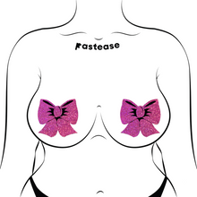 Load image into Gallery viewer, Glittering Hot Pink Bow Nipple Pasties by Pastease®. Two bright pink sparkly big bow shaped nipple covers shown on a femme body outline for size reference on a white background.