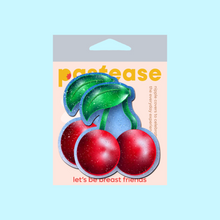 Load image into Gallery viewer, The Cherry: Red Cherries on Glitter Velvet Nipple Pasties by Pastease inside the pastease pastel packaging on a pale blue background. Two bright red cherries made from glittery velvet with green stems and leaf.