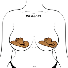 Load image into Gallery viewer, The Wild West Brown Suede Cowboy Hat Nipple Pasties Stylish Nipple Covers by Pastease®. Two suede brown cowboy hat shaped nipple covers shown on a femme body outline for size reference on a white background. Perfect for a festival, burlesque performance, pride or parties.