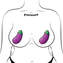 Load image into Gallery viewer, The Eggplant Pasties Fat Purple Emoji Nipple Covers by Pastease shown on a femme body outline on a white background. Two large purple eggplant aubergine vegetable emoji style nipple covers with green leaves at the top. Perfect for a festival, burlesque performance, drag shows, pride or parties.