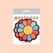 Load image into Gallery viewer,  The Rainbow Flower Pasties Hippy Rainbow Daisy Breast Covers by Pastease®. Two rainbow coloured flower shaped nipple covers in pastease pastel packaging on a light orange background. Perfect for a festival, burlesque performance, pride or parties.