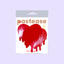 Load image into Gallery viewer, Melty Heart: Faux Latex Pleather Vinyl Red Melty Heart Nipple Pasties by Pastease®. Two shiny red drippy heart shaped nipple covers shown in the pastease packaging on a lilac background.