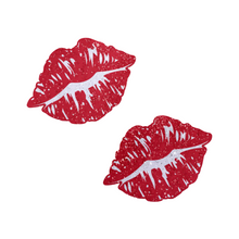 Load image into Gallery viewer, Kisses: Sparkly Red Kissing Puckered Lips Nipple Covers by Pastease. Two glitter red kissing lip shaped nipple covers shown on a white background. Perfect for festivals, pride, burlesque, raves, only fans content or parties.