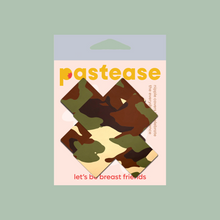 Load image into Gallery viewer, Plus X: Green Camo Cross Nipple Pasties by Pastease®. Two green, brown, and cream camouflage cross shaped nipple covers shown in the pastease packaging on a khaki background.
