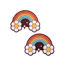 Load image into Gallery viewer, The Rainbow Flower Pasties Nipple Covers by Pastease®. Two glitter velvet retro warm rainbows with flower clouds and white sparkles nipple covers shown on a white background. Perfect for a festival, burlesque performance, pride or parties.