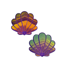 Load image into Gallery viewer, The Mermaid Shells Pasties in Opalescent Purple & Gold Seashell Nipple Covers by Pastease®. Two purple glitter with green to pink iridescent film sea shells on a white background. Perfect for a festival, pride, burlesque performance, only fans content or a party.