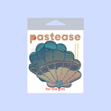 Load image into Gallery viewer, The Mermaid Shells Pasties in Opalescent Seafoam Blue Seashell Nipple Covers by Pastease®. Two blue green seafoam glitter with gold to pink iridescent film sea shells in the pastease pastel packaging on a pastel lilac background. Perfect for a festival, pride, burlesque performance, only fans content or a party.