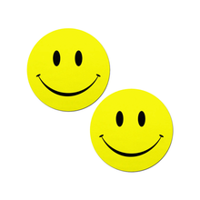 Load image into Gallery viewer, Smiley Faces: Bright Yellow Nipple Pasties by PasteaseĀ®. Two yellow smiley face nipple covers, shown on white background. Perfect for a festival, burlesque performance, pride or parties.