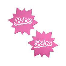 Load image into Gallery viewer, Babe Doll Pink Sunburst Pasties by PasteaseĀ®. Two barbie pink coloured sunburst star nipple covers with babe written in the centre shown on a white background. Perfect for festivals, pride, burlesque, raves, only fans content or parties.