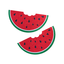 Load image into Gallery viewer, The Watermelon Slice with a Bite Breast Pasties by Pastease®. Two glittery velvet watermelon slices with some black heart shaped seeds with a bite mark out of it nipple covers on a white background. Perfect for a festival, burlesque performance, drag shows, pride or parties.