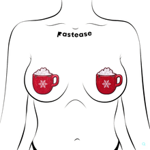 Load image into Gallery viewer, Hot Cocoa Pasties Hot Chocolate Nipple Covers by Pastease®. Two red glittery mug shaped nipple covers with white snowflake on the front of the mug and marshmallows on top. Shown on outline of feminine chest.