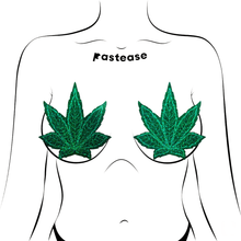 Load image into Gallery viewer, Coverage: Pot Leaf Glitter Green Full Breast Covers Support Tape by PasteaseĀ®. Two green glittery weed leaf shaped nipple covers shown on a femme body outline for size reference on a white background. Perfect for a festival, pride, burlesque performance, only fans content, 420 or a party.