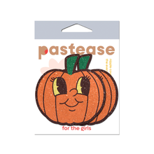 Load image into Gallery viewer, Pumpkin Breast Pasties Cutie Pie Face Jack O Lantern Nipple Covers by Pastease. These glittery pumpkin nipple covers have cute cartoon smiling faces with big eyes shown in their pastease packet on a white background.