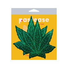 Load image into Gallery viewer, Coverage: Pot Leaf Glitter Green Full Breast Covers Support Tape by PasteaseĀ®. Two green glittery weed leaf shaped nipple covers in the pastease yellow cellophane packaging on a white background. Perfect for a festival, pride, burlesque performance, only fans content, 420 or a party.