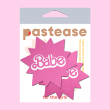 Load image into Gallery viewer, Babe Doll Pink Sunburst Pasties by PasteaseĀ®. Two barbie pink coloured sunburst star nipple covers with babe written in the centre shown in the pastease packaging on a baby pink background.