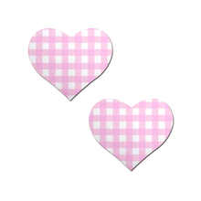 Load image into Gallery viewer, Love: Pink Gingham Heart by PasteaseĀ®. Two pink gingham check pattern heart shaped nipple covers on a white background. Perfect for a festival, pride, burlesque performance, only fans content or a party.