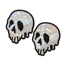Load image into Gallery viewer, Skull Melt Pasties: Shattered Glass Drip Skull by Pastease® o/s. Two iridescent skull silver black shaped nipple covers on a white background. Perfect for a festival, pride, burlesque performance, only fans content or a party.
