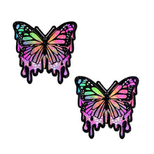 Load image into Gallery viewer, Butterfly Melt Trippy Glitter Rainbow Nipple Pasties by Pastease® o/s. Two glittery butterfly pastel rainbow drippy butterfly shaped nipple covers on a white background. Perfect for festivals, pride, burlesque, raves, only fans content or parties.