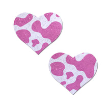 Load image into Gallery viewer, Love: Pink Strawberry Cow Print Heart on Soft Glittery Velvet Nipple Pasties by Pastease. Two glittery pink and white velvet heart shaped nipple covers on a white background. Perfect for a festival, pride, burlesque performance, only fans content or a party.