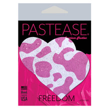 Load image into Gallery viewer, Love: Pink Strawberry Cow Print Heart on Soft Glittery Velvet Nipple Pasties by Pastease shown in the pink and black pastease cellophane packaging on a white background.