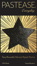 Load image into Gallery viewer, Everyday reusable liquid black star with mini hearts reusable nipple pasties by pastease everyday o/s shown on the pastease everyday black and gold packaging backing card. Perfect for a festival, pride, burlesque performance, only fans content or a party.