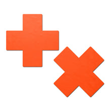 Load image into Gallery viewer, The Plus X: Neon Orange (Blacklight Reactive) Cross Nipple Pasties by Pastease. Two neon orange Cross Plus X nipple covers on a white background. Perfect for a festival, pride, burlesque performance, only fans content or a party.