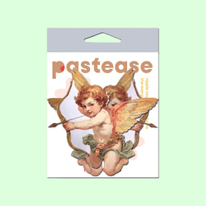 A pastel green background featuring the Pastease Cupid Cherub Vintage Breast Pasties packaging. The packaging shows two cherubic cupids with bows and arrows, designed in a romantic vintage style. Pastease is a small family-operated brand creating fun, flirty nipple covers for all breast shapes and sizes, perfect for Valentine's Day or playful occasions. Made in the USA, these pasties are an adorable and unique accessory.