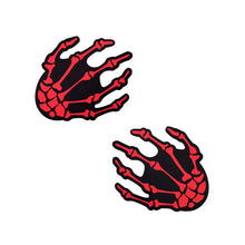 Load image into Gallery viewer, Pair of Blood Red Boney Skeleton Hands on Black Nipple Pasties by Pastease®. Striking red skeleton hand design adds a spooky, flirty touch. Self-adhesive, comfortable, and easy to wear. Manufactured in the USA for diverse body shapes and sizes.
