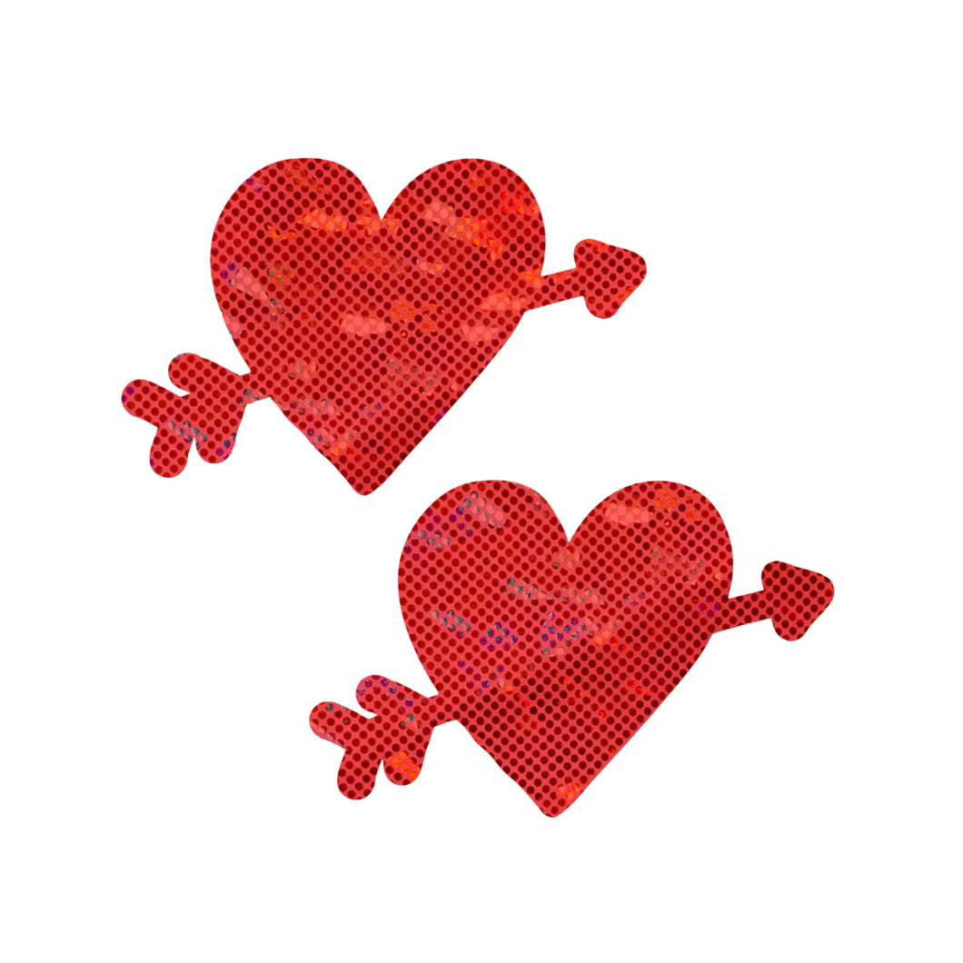 A pair of Cupid's Arrow Red Heart Breast Pasties by Pastease®. The sparkly red heart design with an arrow is bold and playful, offering a fun way to add flair to any outfit or intimate moment. Designed for comfort and style, these are handmade in the USA.