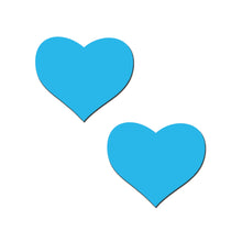 Load image into Gallery viewer, A pair of Pastease® Glow in the Dark Neon Turquoise Heart Pasties displayed on a white background. These luminous, heart-shaped nipple covers are made for all breast shapes and sizes, offering a fun, playful vibe, and are crafted by a family-operated USA brand.
