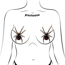 Load image into Gallery viewer, Model wearing Black Widow Pasties on Sparkling Velvet Halloween Breast Covers by Pastease®. Spider-shaped nipple covers add a sultry yet playful touch with their velvet sparkle and bold red hourglass detail. Perfect for spooky season, handmade for all breast shapes and sizes.
