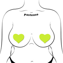 Load image into Gallery viewer, Pastease Love Glow in the Dark Neon Yellow Heart Nipple Covers worn by an illustrated figure. Showcasing a cheeky and stylish fit, these pasties are skin-safe, waterproof, and glow brilliantly in the dark. Handmade in the USA by Pastease®.
