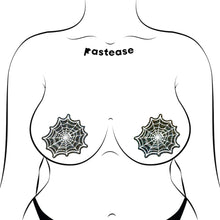 Load image into Gallery viewer, Web: Glitter Black Glow in the Dark Spooky Spider Web Nipple Covers by Pastease®, styled on a fuller figure illustration. Featuring glittery black and white spiderweb shapes. Made in the USA, perfect for bold lingerie outfits and designed for all breast sizes.
