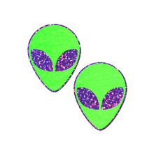 Load image into Gallery viewer, Alien: Glow-In-The-Dark with Glittering Purple Eyes Nipple Pasties by Pastease®. Two bright green extraterrestrial alien heads with glitter purple eyes nipple covers shown on a white background. Perfect for festivals, pride, burlesque, raves, only fans content or parties.
