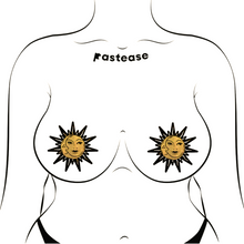 Load image into Gallery viewer, Sunburst: Sun &amp; Moon Faces on Gold Glitter Sun Nipple Pasties by Pastease®. Two glittery gold and black nipple covers in the shape of a sun and moon, shown on drawing of chest. Perfect for a festival, burlesque performance, pride or parties.
