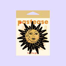 Load image into Gallery viewer, Sunburst: Sun &amp; Moon Faces on Gold Glitter Sun Nipple Pasties by Pastease®. Two glittery gold and black nipple covers in the shape of a sun and moon, shown on a pastel purple background. Perfect for a festival, burlesque performance, pride or parties.
