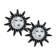 Load image into Gallery viewer, Sunburst: Sun &amp; Moon Faces on Silver Glitter Sun Nipple Pasties by Pastease®. Two glittery silver and black nipple covers in the shape of a sun and moon, shown on a white background. Perfect for a festival, burlesque performance, pride or parties.
