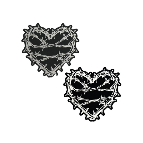 The Barbed Wire Heart Pasties Reflective Nipple Covers by Pastease®. Two black hearts with silver reflective barbed wire patterned shaped nipple covers shown on a white background. Perfect for festivals, pride, burlesque, raves, only fans content or parties.