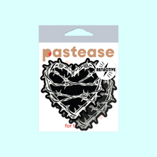 Load image into Gallery viewer, The Barbed Wire Heart Pasties Reflective Nipple Covers by Pastease®. Two black hearts with silver reflective barbed wire patterned shaped nipple covers shown in the pastease pastel packaging on a pastel blue background. Perfect for festivals, pride, burlesque, raves, only fans content or parties.
